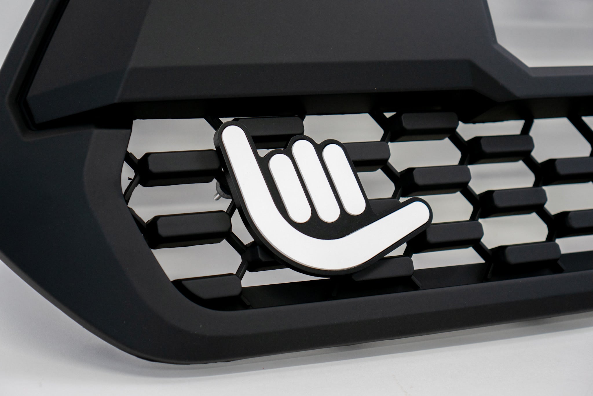 Shaka Grille Badge – Venture Tread